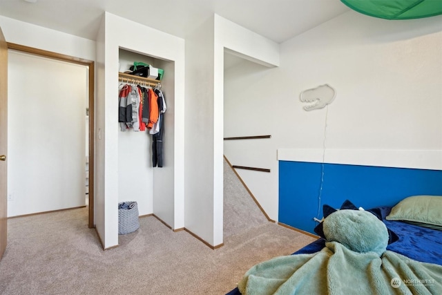 carpeted bedroom with a closet