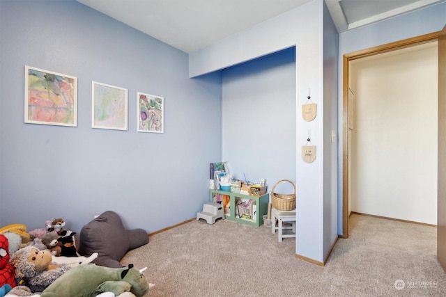 rec room with light colored carpet