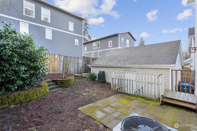 back of property with a patio and cooling unit