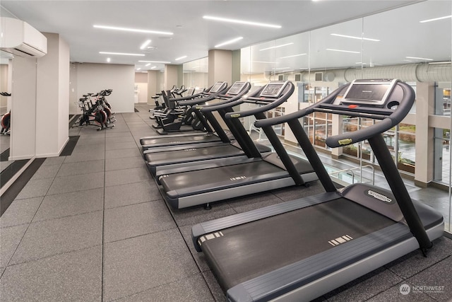 workout area with an AC wall unit