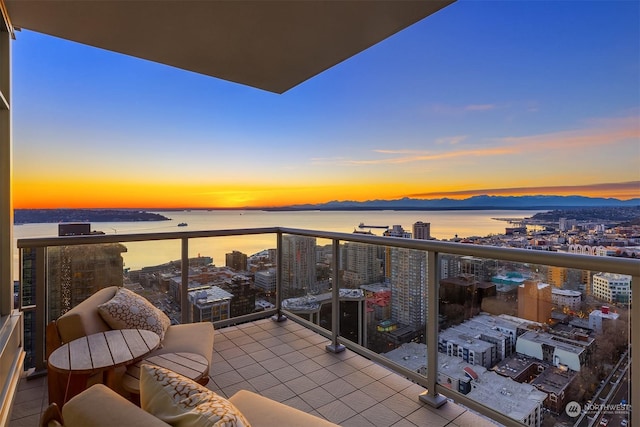 balcony at dusk with a water view