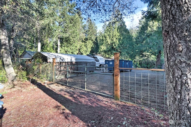 view of gate with an outdoor structure