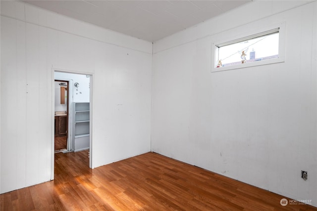 spare room with hardwood / wood-style floors