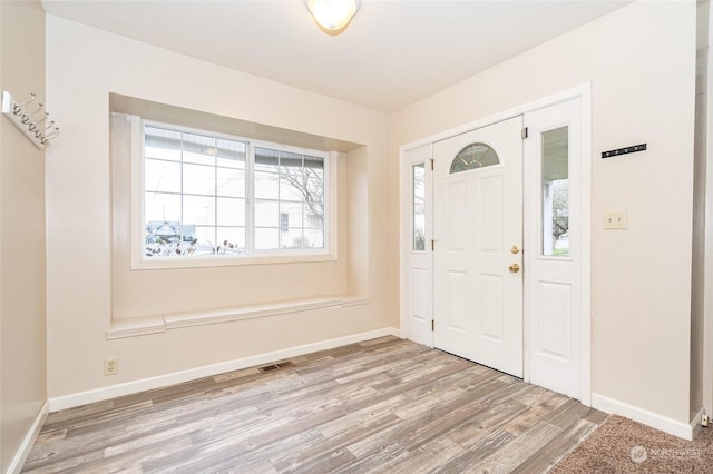 foyer with light hardwood / wood-style flooring