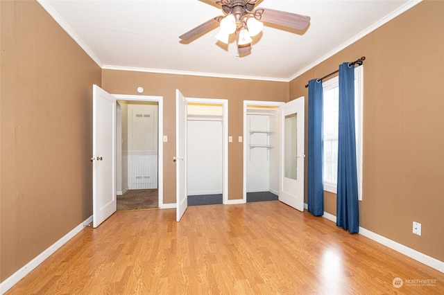 unfurnished bedroom featuring ceiling fan, light hardwood / wood-style floors, ornamental molding, and a closet