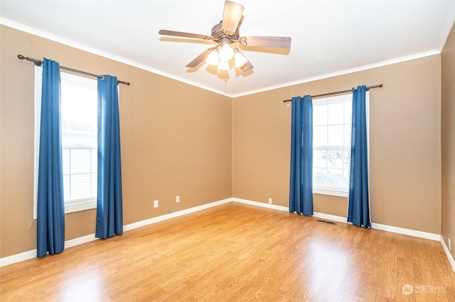 unfurnished room featuring ceiling fan, crown molding, and wood-type flooring