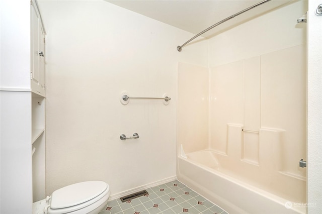 bathroom featuring toilet, shower / bathing tub combination, and tile patterned flooring