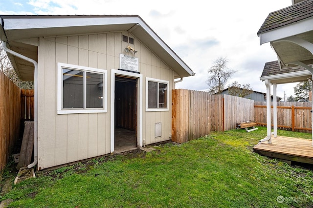 view of outbuilding with a yard