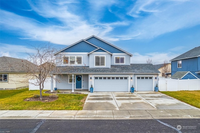 view of front of house with a front yard and a garage