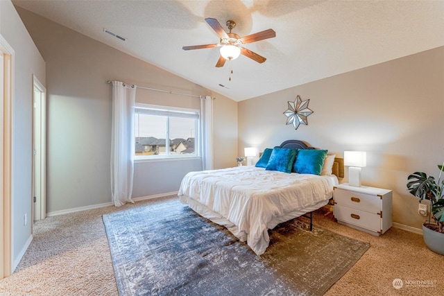 carpeted bedroom featuring a textured ceiling, ceiling fan, and lofted ceiling