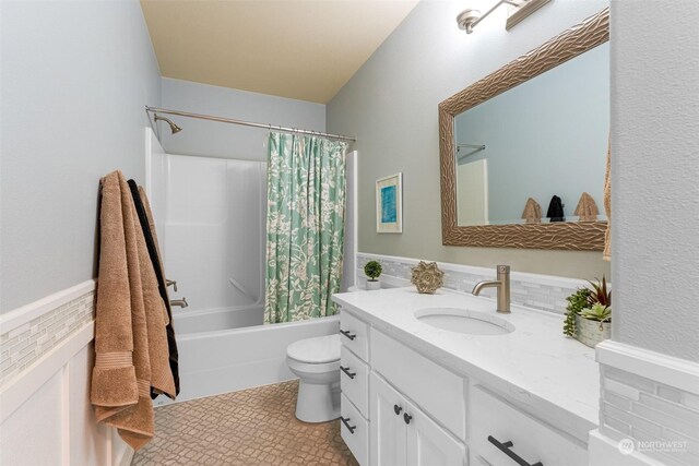 full bathroom with vanity, toilet, and shower / bathtub combination with curtain