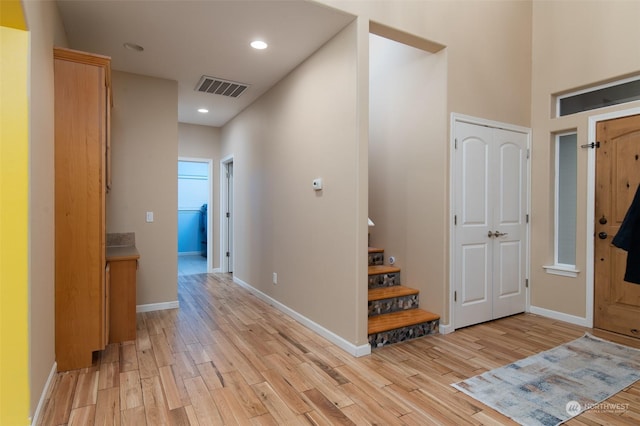 foyer entrance with light hardwood / wood-style flooring