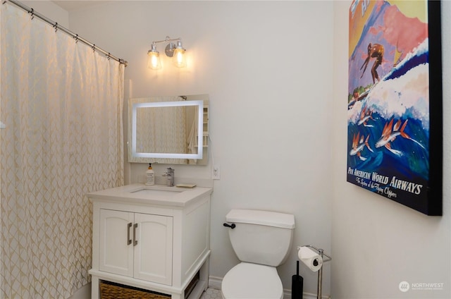 bathroom with a shower with curtain, vanity, and toilet