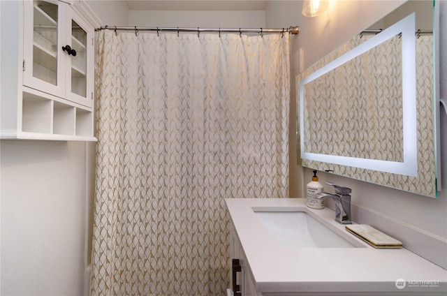 bathroom featuring vanity and walk in shower