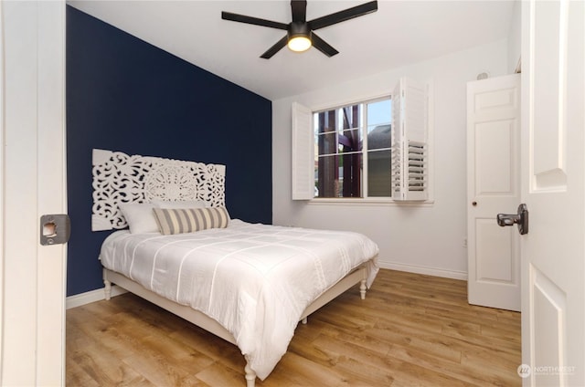 bedroom featuring light hardwood / wood-style flooring and ceiling fan