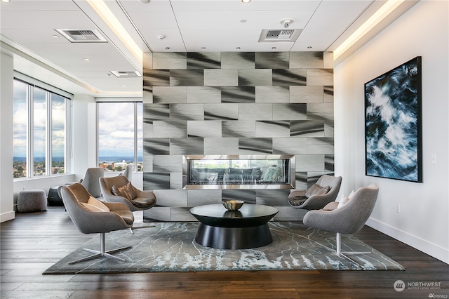 sitting room with hardwood / wood-style flooring