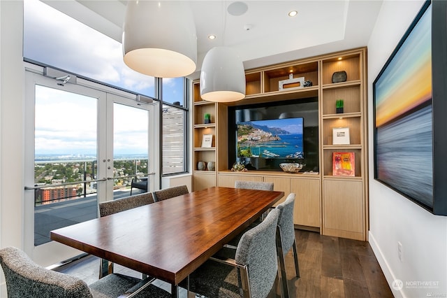 dining room with french doors and dark hardwood / wood-style floors