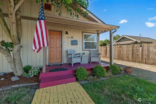 doorway to property featuring a porch