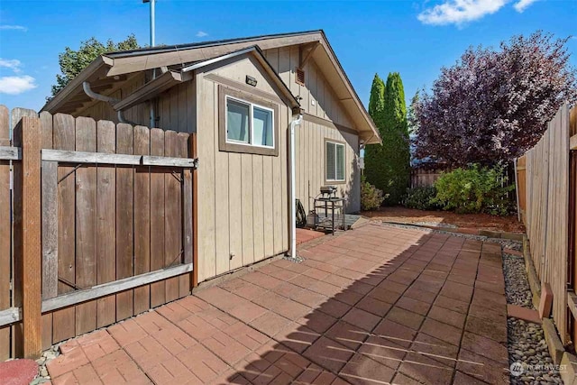 view of side of property featuring a patio