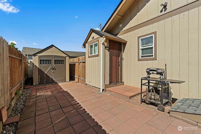 view of patio / terrace featuring a storage unit