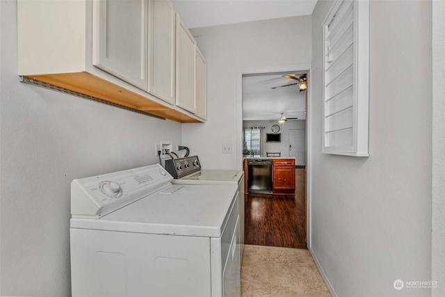 clothes washing area with washer and dryer, ceiling fan, and cabinets