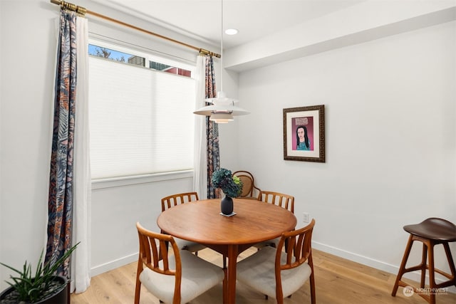 dining room with light hardwood / wood-style floors and a wealth of natural light