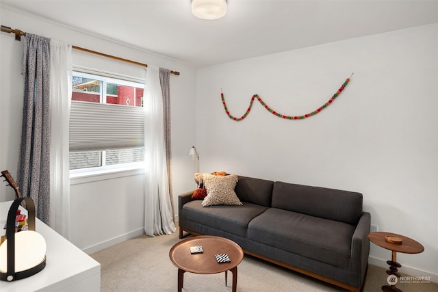 living room featuring a healthy amount of sunlight and light colored carpet