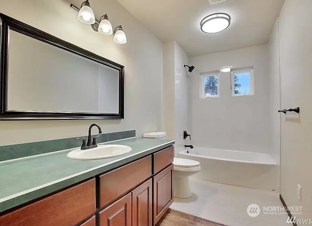 full bathroom featuring vanity, toilet, and bathing tub / shower combination