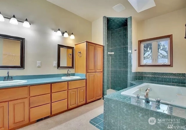 bathroom featuring vanity and shower with separate bathtub