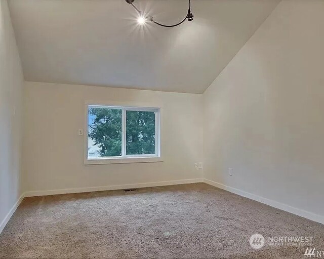 bonus room with carpet and lofted ceiling