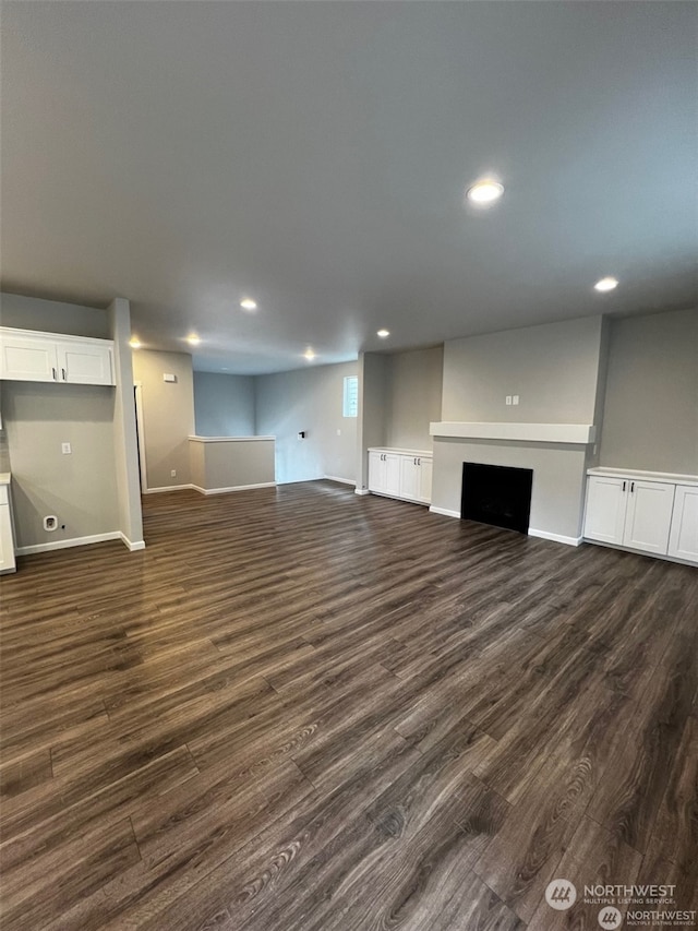 basement featuring dark hardwood / wood-style flooring