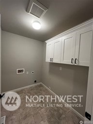 washroom featuring electric dryer hookup, cabinets, and hookup for a washing machine