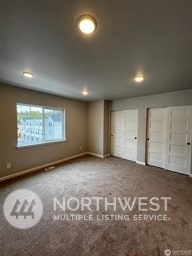 unfurnished bedroom featuring carpet