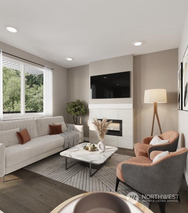 living room with dark wood-type flooring and a fireplace