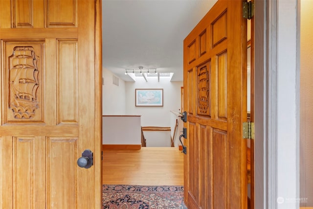 hall featuring hardwood / wood-style floors