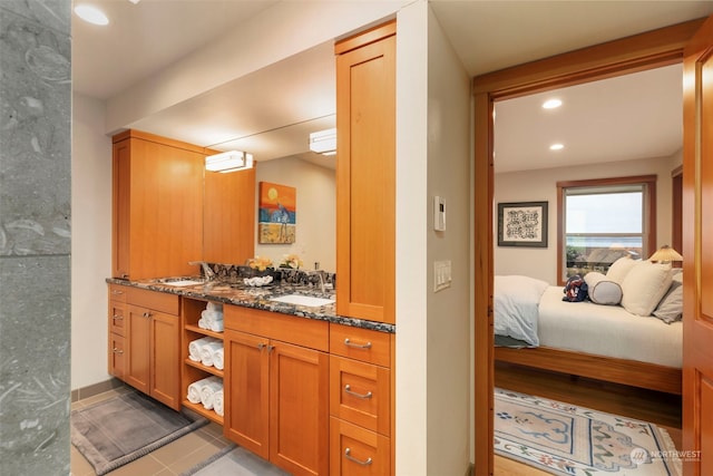 bathroom with vanity and tile patterned floors