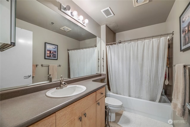 full bathroom with vanity, toilet, and shower / bath combo with shower curtain