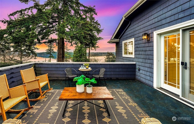 view of patio terrace at dusk