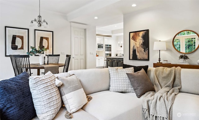 living room with a notable chandelier