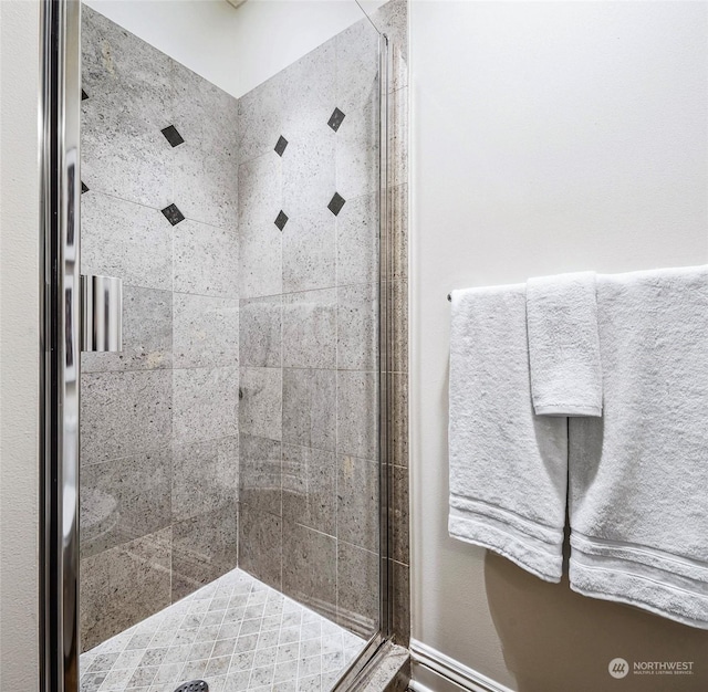 bathroom featuring an enclosed shower