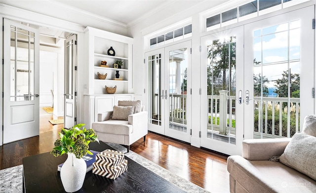 interior space featuring built in shelves, dark hardwood / wood-style floors, plenty of natural light, and french doors