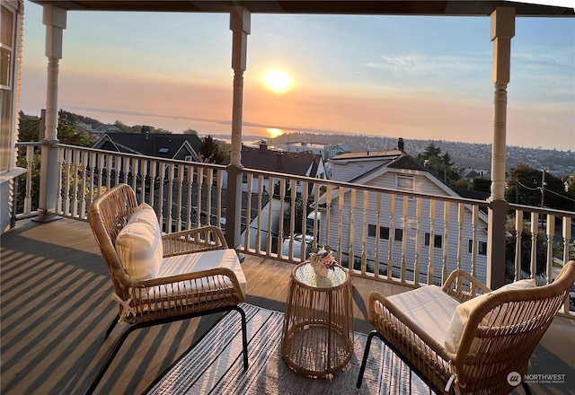 view of balcony at dusk