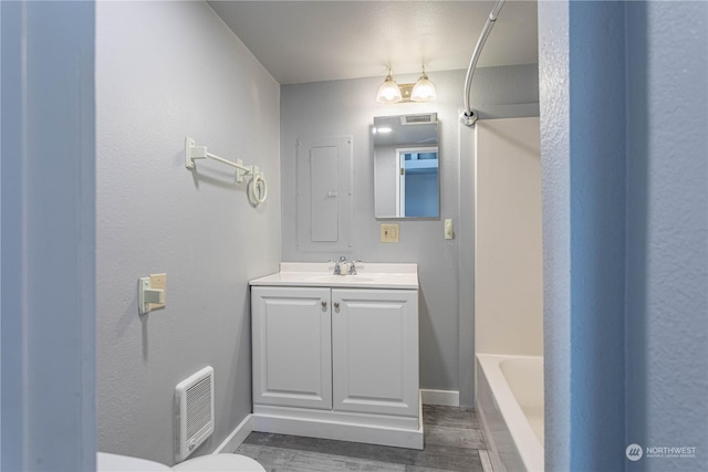 full bathroom with shower / tub combination, vanity, and toilet