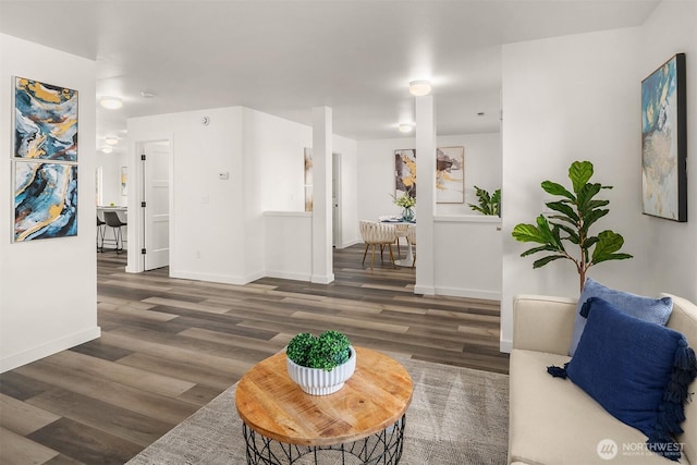 living area featuring wood finished floors and baseboards