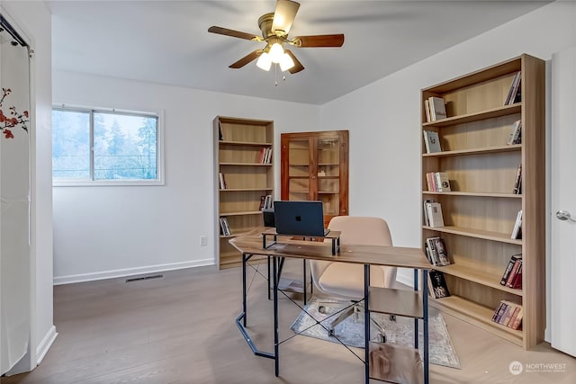 office area featuring hardwood / wood-style floors and ceiling fan