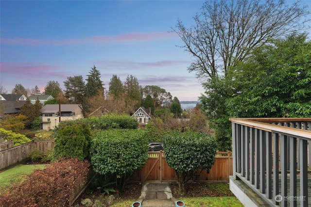 view of yard at dusk