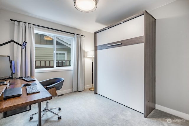 office featuring light carpet and baseboards