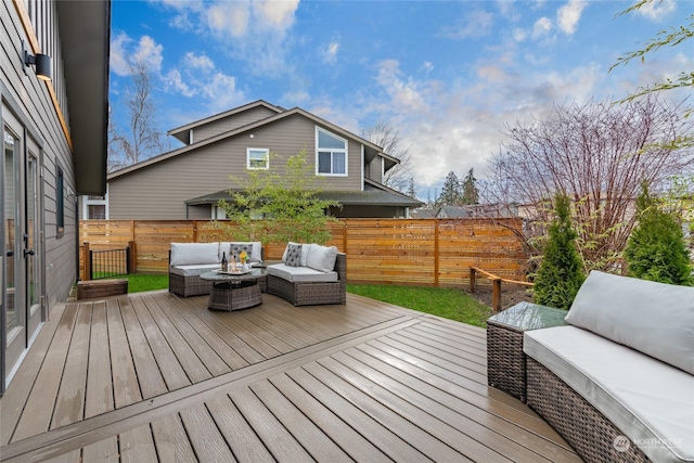 wooden terrace with fence and an outdoor living space