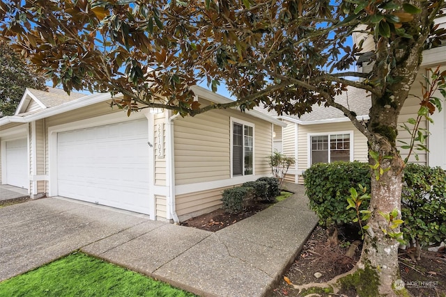 view of side of property with a garage