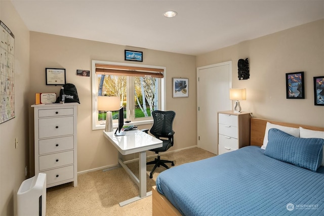 bedroom featuring light carpet